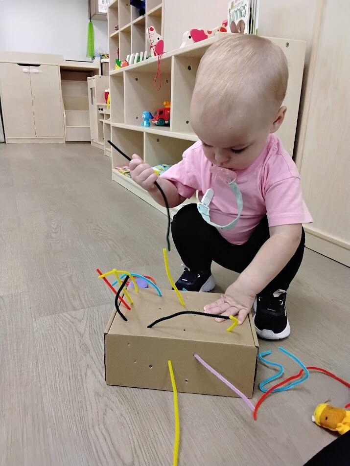 Kid playing with box